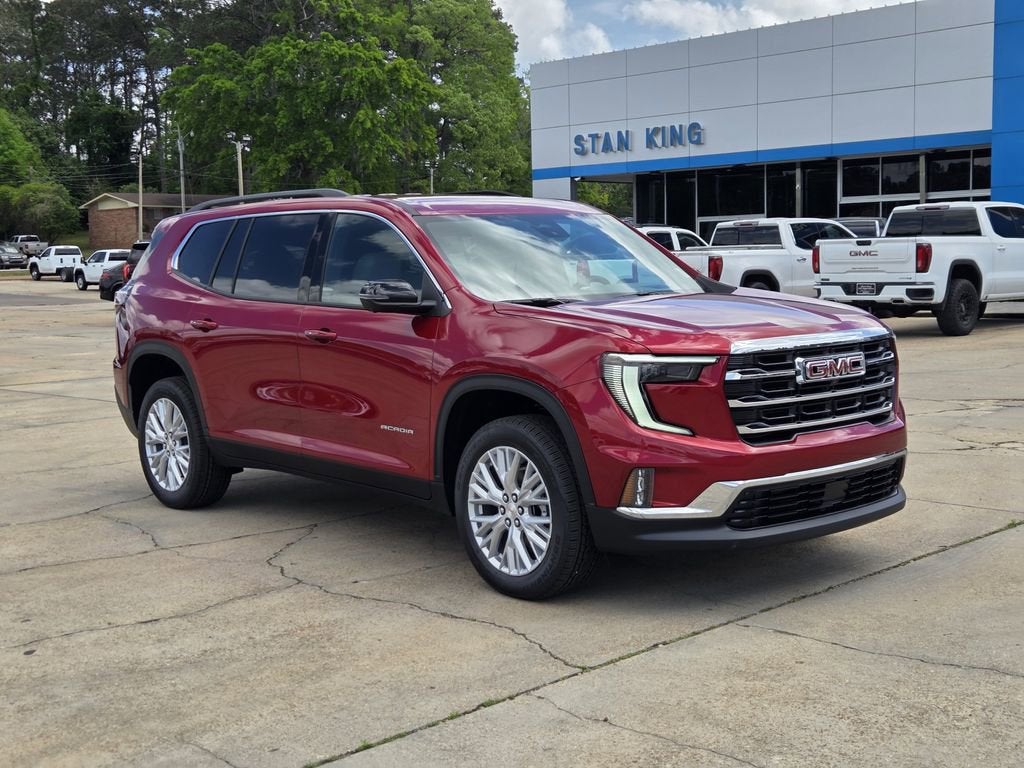 2026 GMC Acadia Elevation in Volcanic Red Tintcoat — front three-quarter view