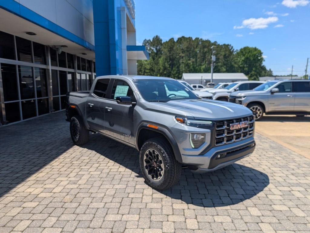 2026 GMC Canyon AT4 in Sterling Metallic — front three-quarter view