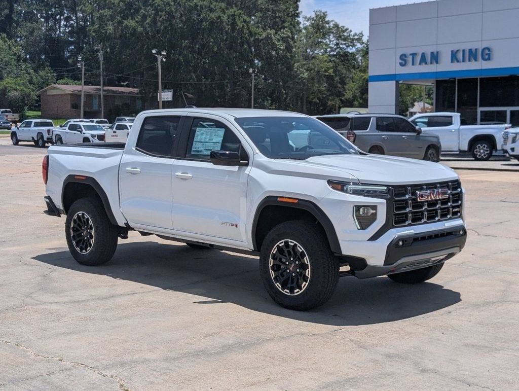 2026 GMC Canyon AT4 in Summit White — front three-quarter view
