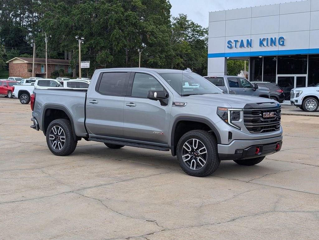 2026 GMC Sierra 1500 AT4 in Sterling Metallic — front three-quarter view